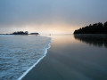 A soft, gentle wave rolls in across Chesterman Beach, Tofino, BC.