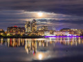 The moon shines brightly across the Inner Harbour of Victoria, BC